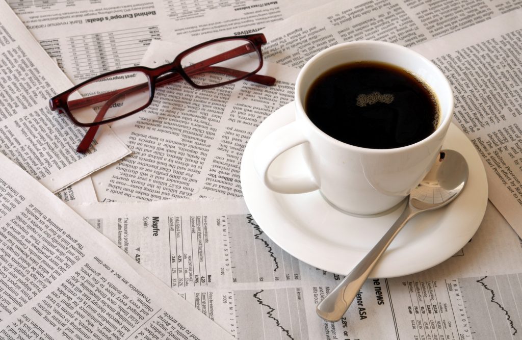 coffee over newspaper